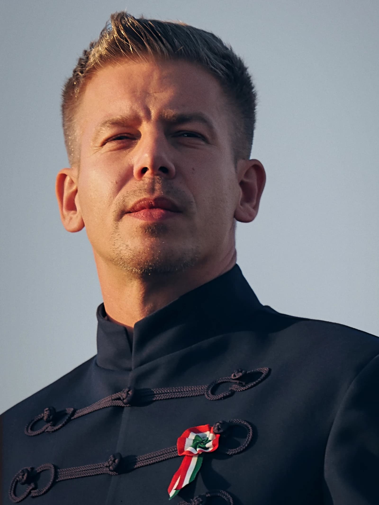 Péter Magyar, a Hungarian politician, looking forward at an event.