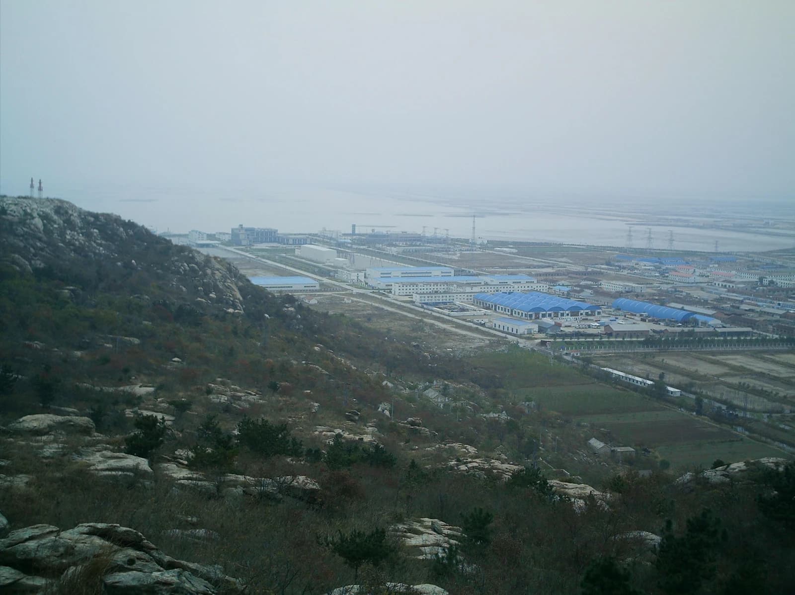 Aerial view of the Tianwan Nuclear Power Station in China with multiple buildings.