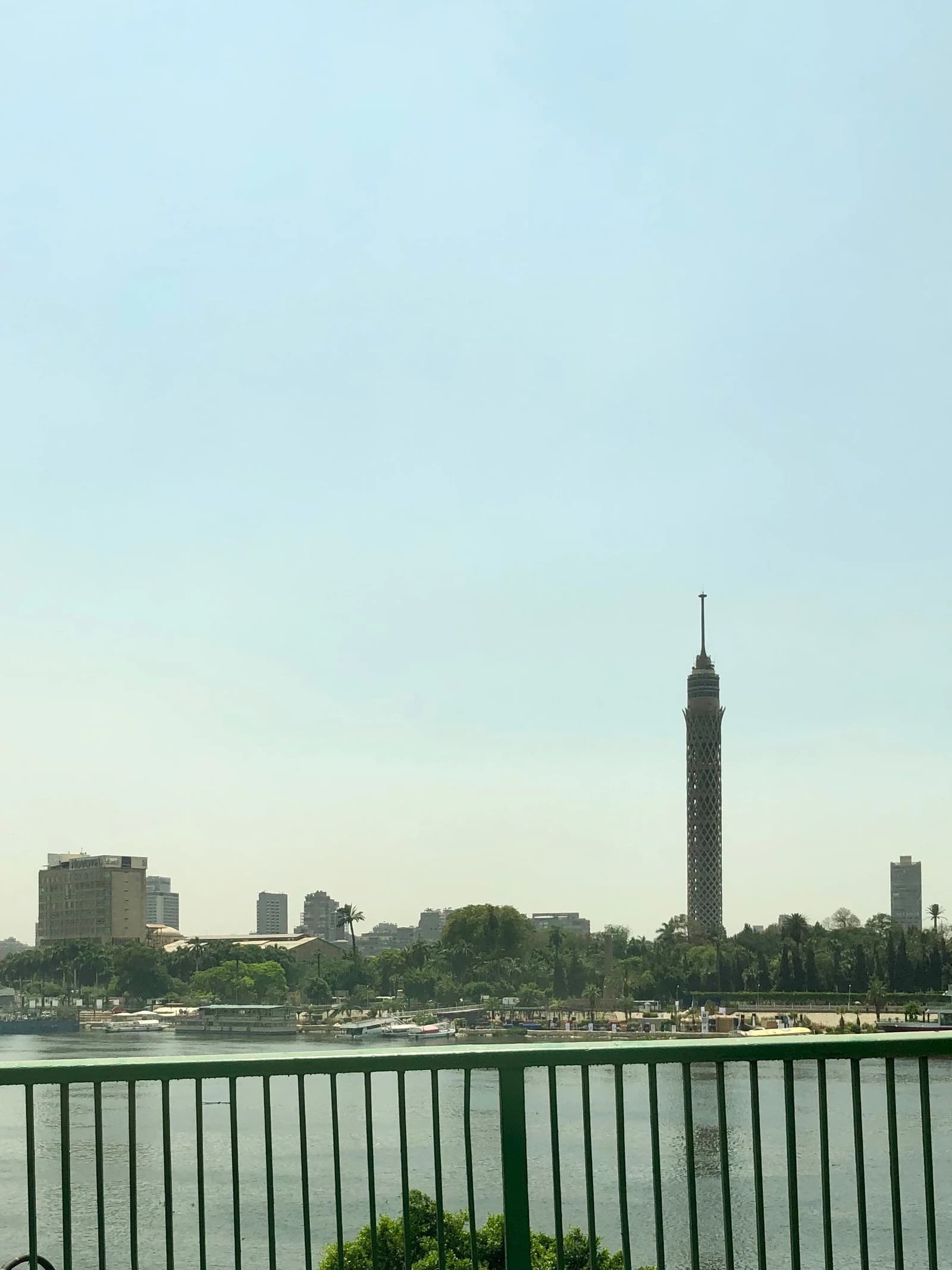 View of the Cairo Tower and buildings on the bank of the Nile River.