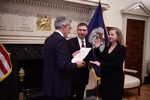 Jerome H. Powell administering an oath to Michelle W. Bowman at the Federal Reserve.