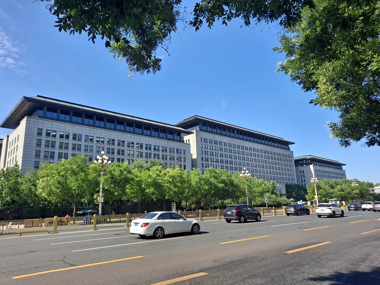 Building of the Ministry of Commerce of the People's Republic of China, with cars on a street in front.