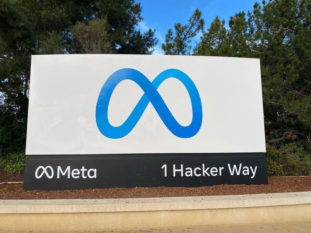 Meta headquarters sign displaying the company logo and address 1 Hacker Way.