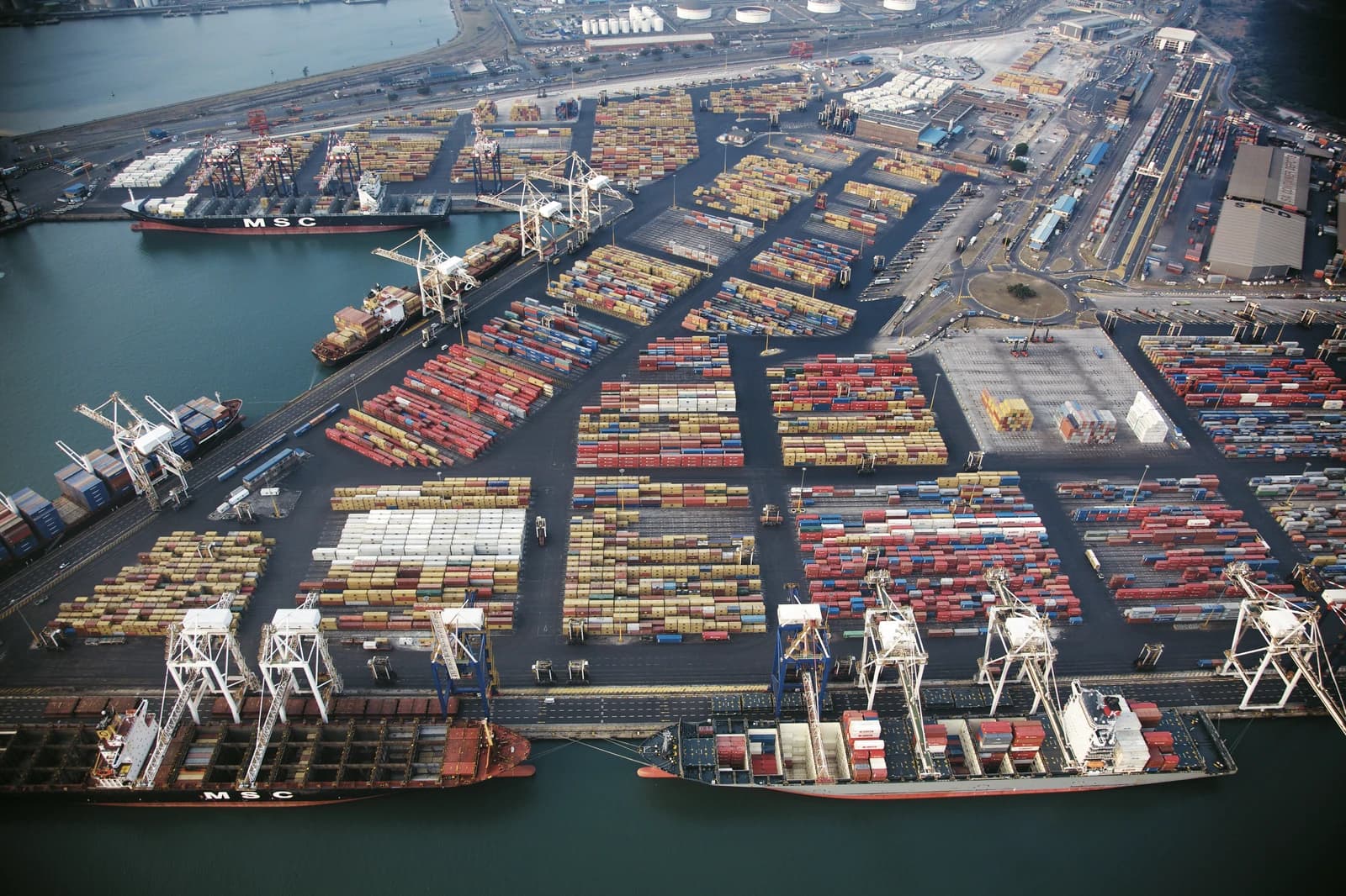 Aerial view of Durban container port showing ships and stacked containers.