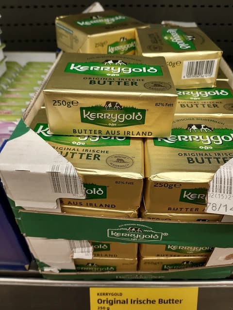 Kerrygold butter packages on a supermarket shelf.
