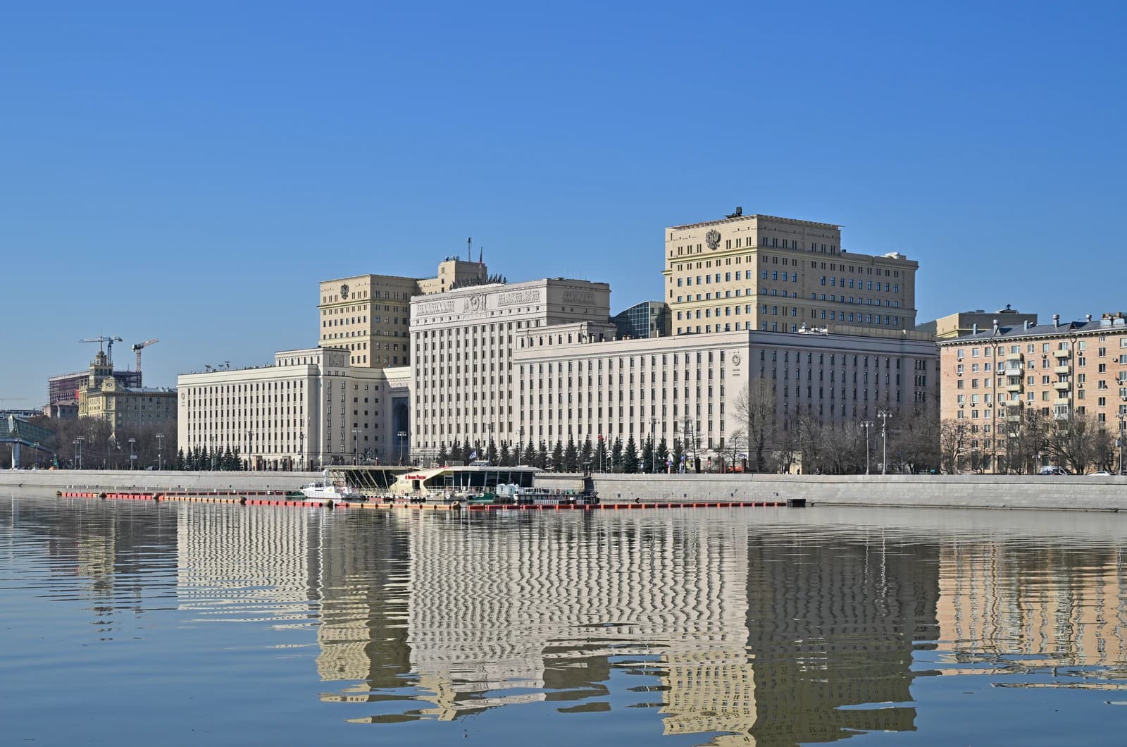 The Ministry of Defense building in Moscow, Russia, seen from across a river.