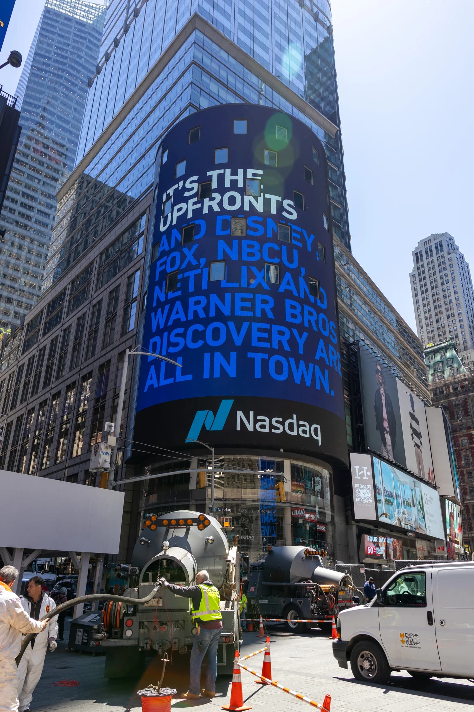 The Nasdaq Tower in Times Square, New York City, displays advertisements.