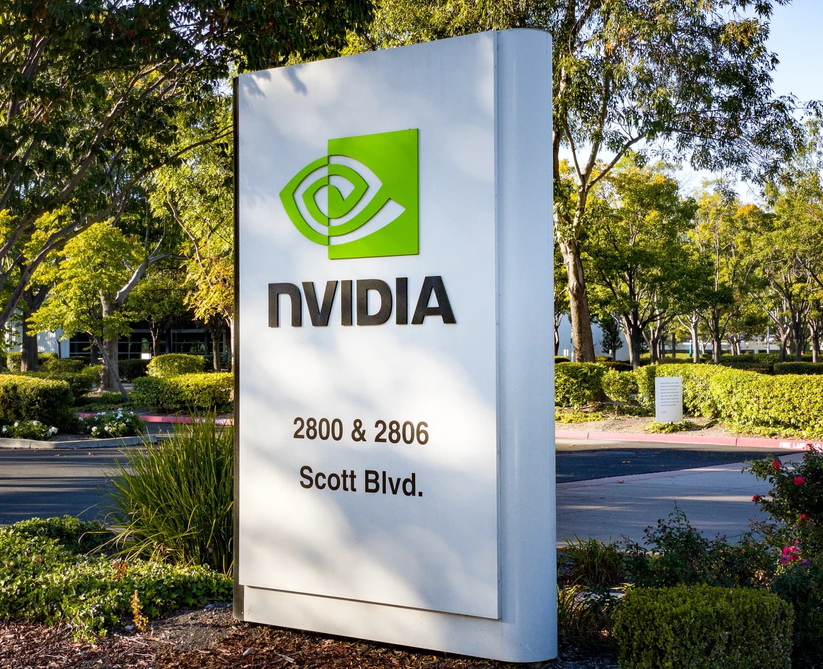 Nvidia sign and logo at the entrance of the company's headquarters.