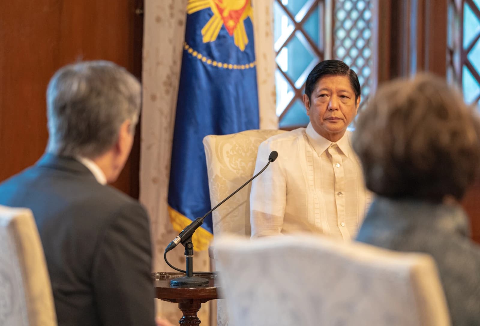 Philippine President Ferdinand Romualdez Marcos Jr. sits in a chair during a meeting.