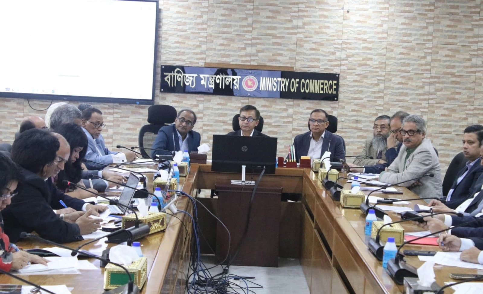 Commerce Minister Khandaker Abdul Muktadir and State Minister Md Sharif-ul Alam lead a meeting with businessmen in Dhaka.