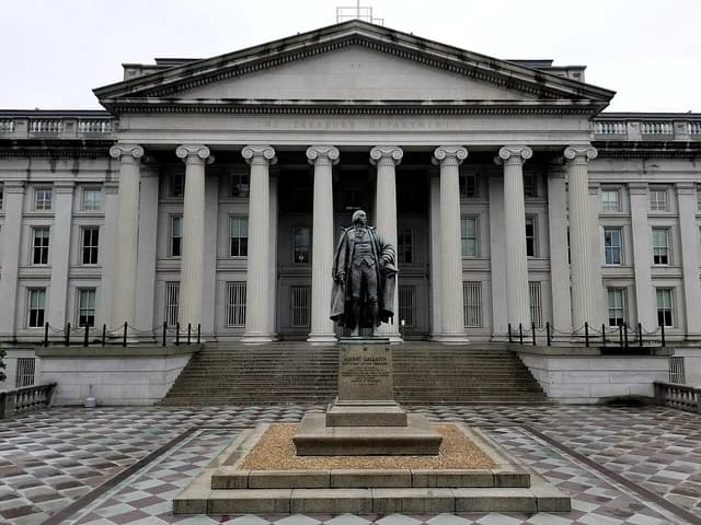 The U.S. Treasury Building and the Albert Gallatin statue in Washington, D.C.