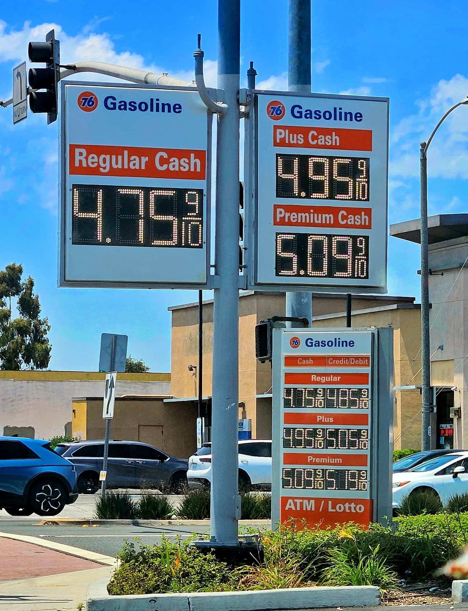 Digital sign at a Union 76 gas station displaying gas prices in the daytime.
