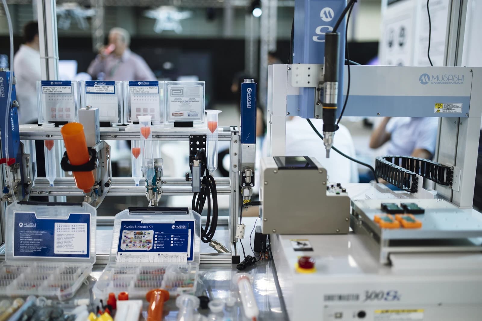 Robotic arm and automated equipment in an industrial or laboratory setting.