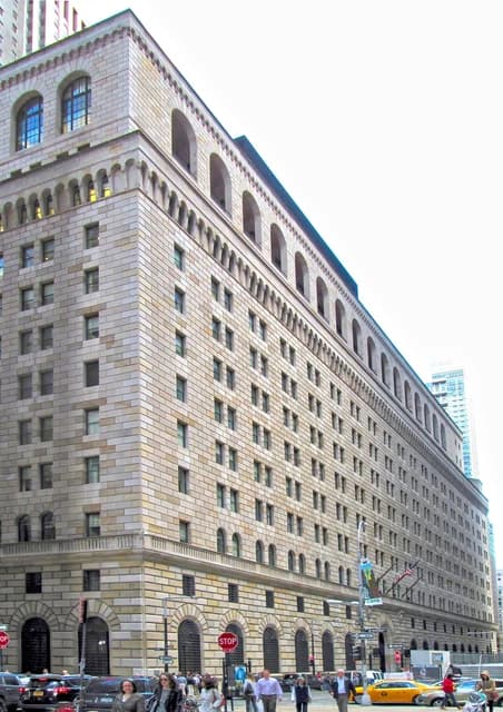 Exterior view of the Federal Reserve Bank of New York building from the west.