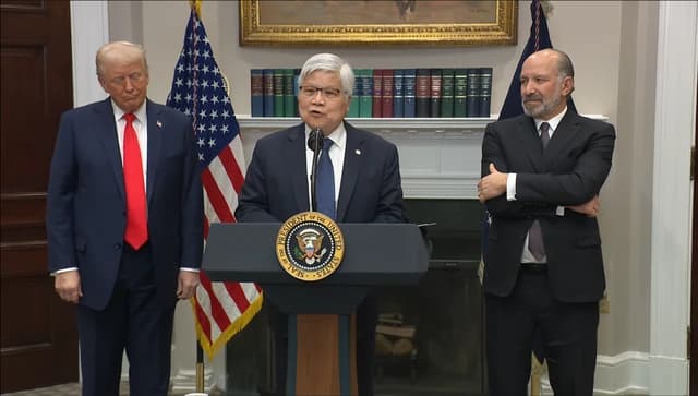TSMC Chairman C.C. Wei speaks at a podium, Donald Trump and another man stand beside him.