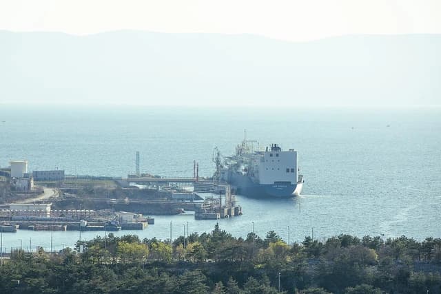 Oil tanker LNG Croatia docked at a cargo terminal with refinery infrastructure.