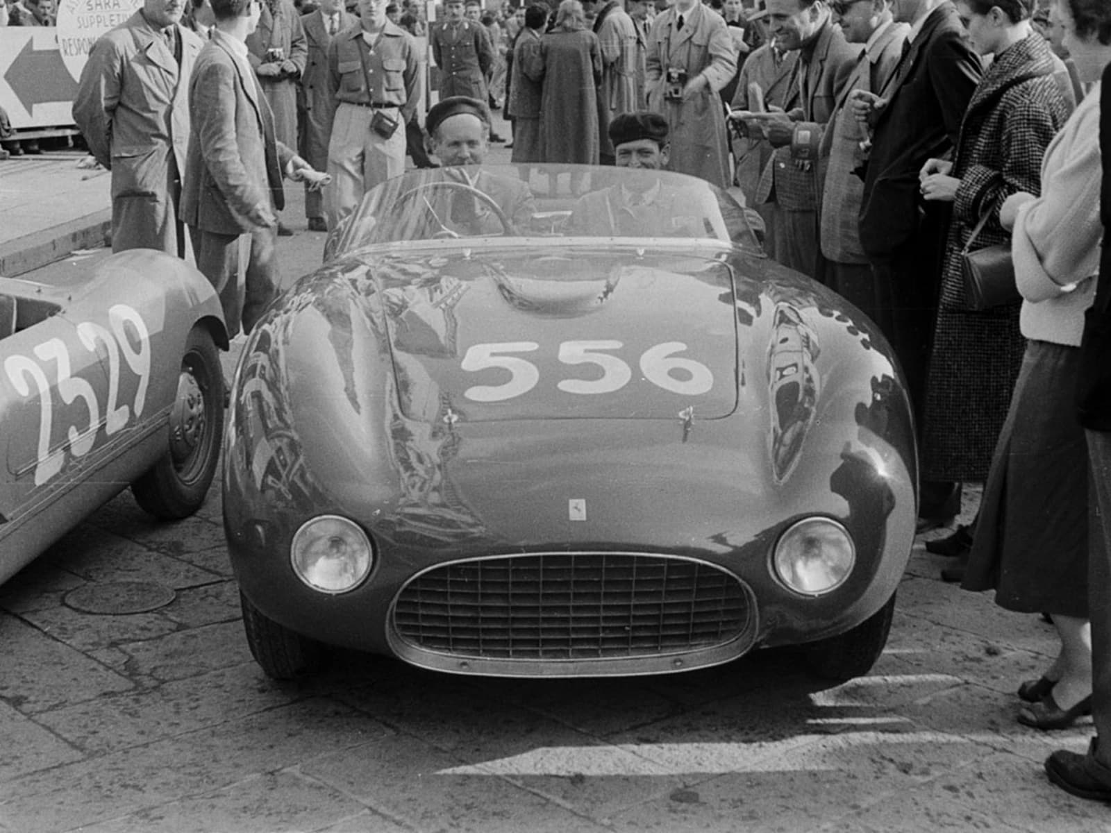 Drivers Graffenried and Parravicini in a 1954 Ferrari 166 0272M race car.