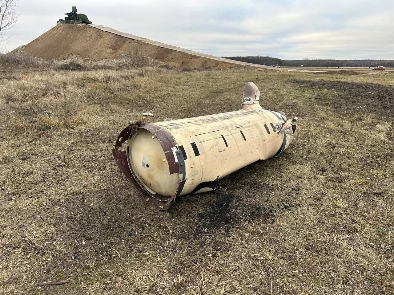 Fragments of an ATACMS missile on the ground, with a Pantsir air defense system in the background.
