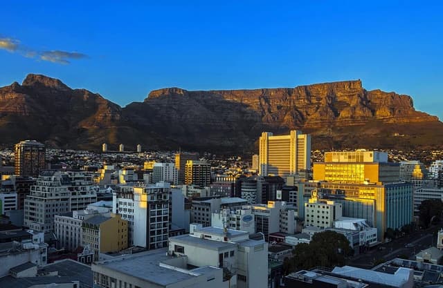 Cape Town cityscape with Devil's Peak and Table Mountain in the background.