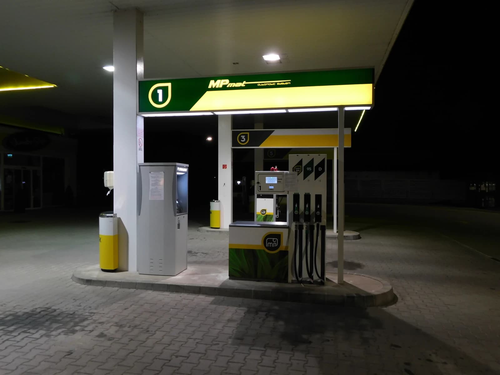 Mobil Petrol gas station at night in Hódmezővásárhely, Hungary.