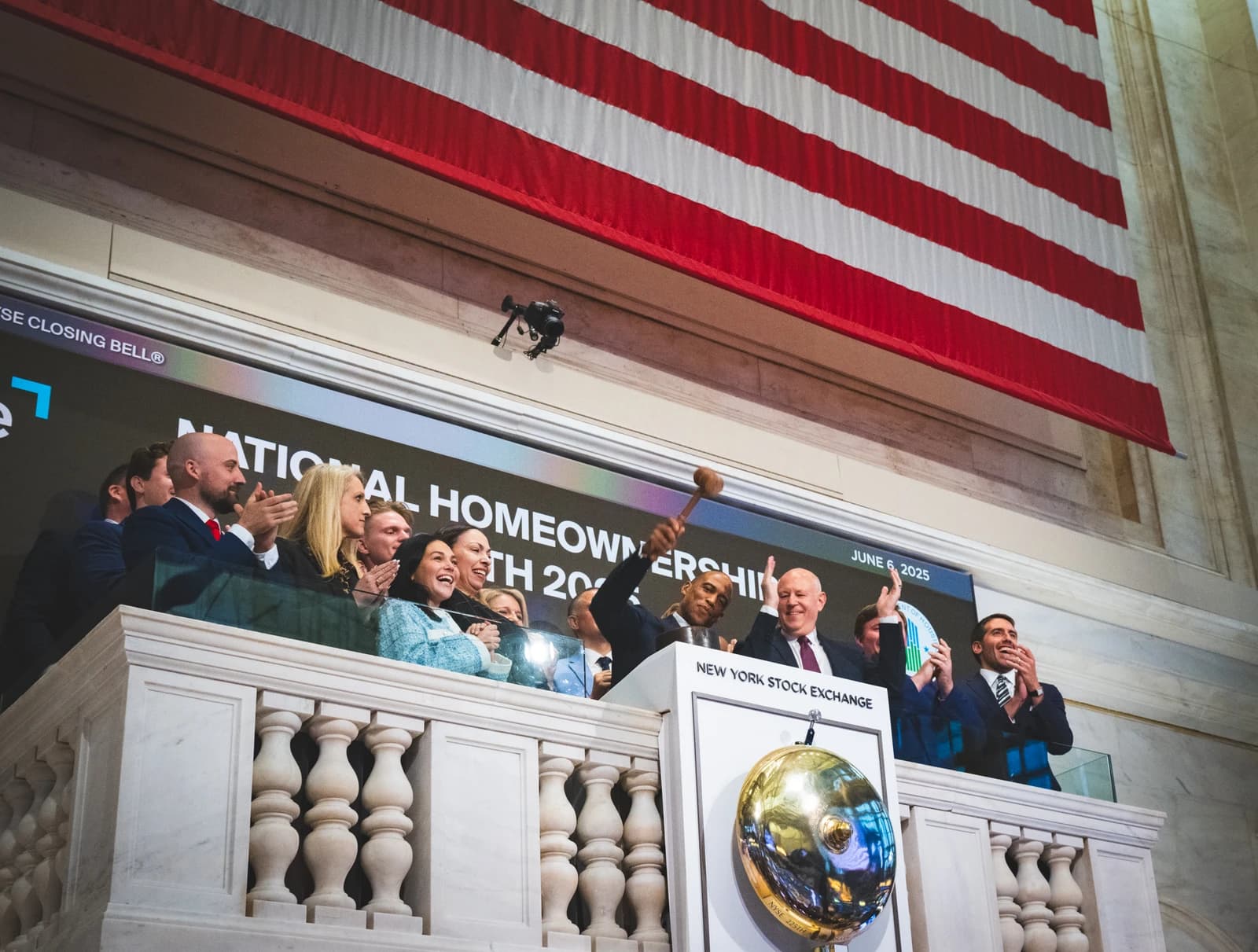 Secretary Turner, with other individuals, rings the closing bell at the New York Stock Exchange.