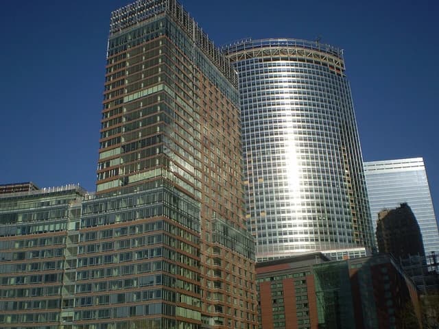 Goldman Sachs New World Headquarters building, a modern skyscraper with glass and brick facades.