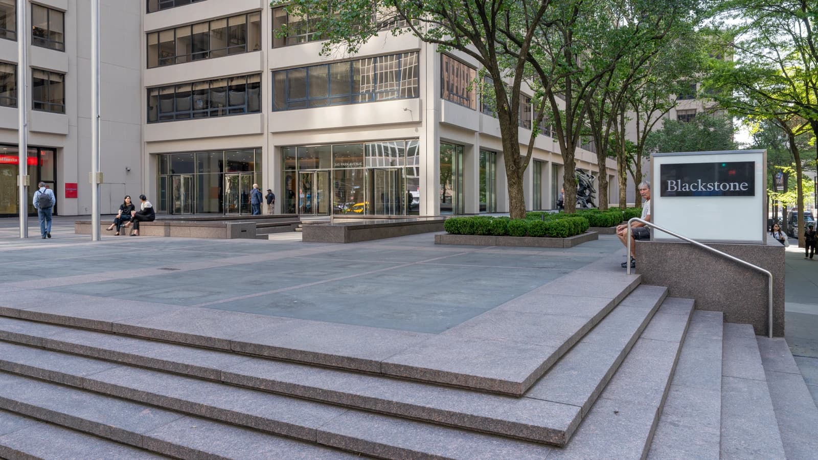 Exterior view of the Blackstone Group headquarters building, with a prominent sign reading "Blackstone".
