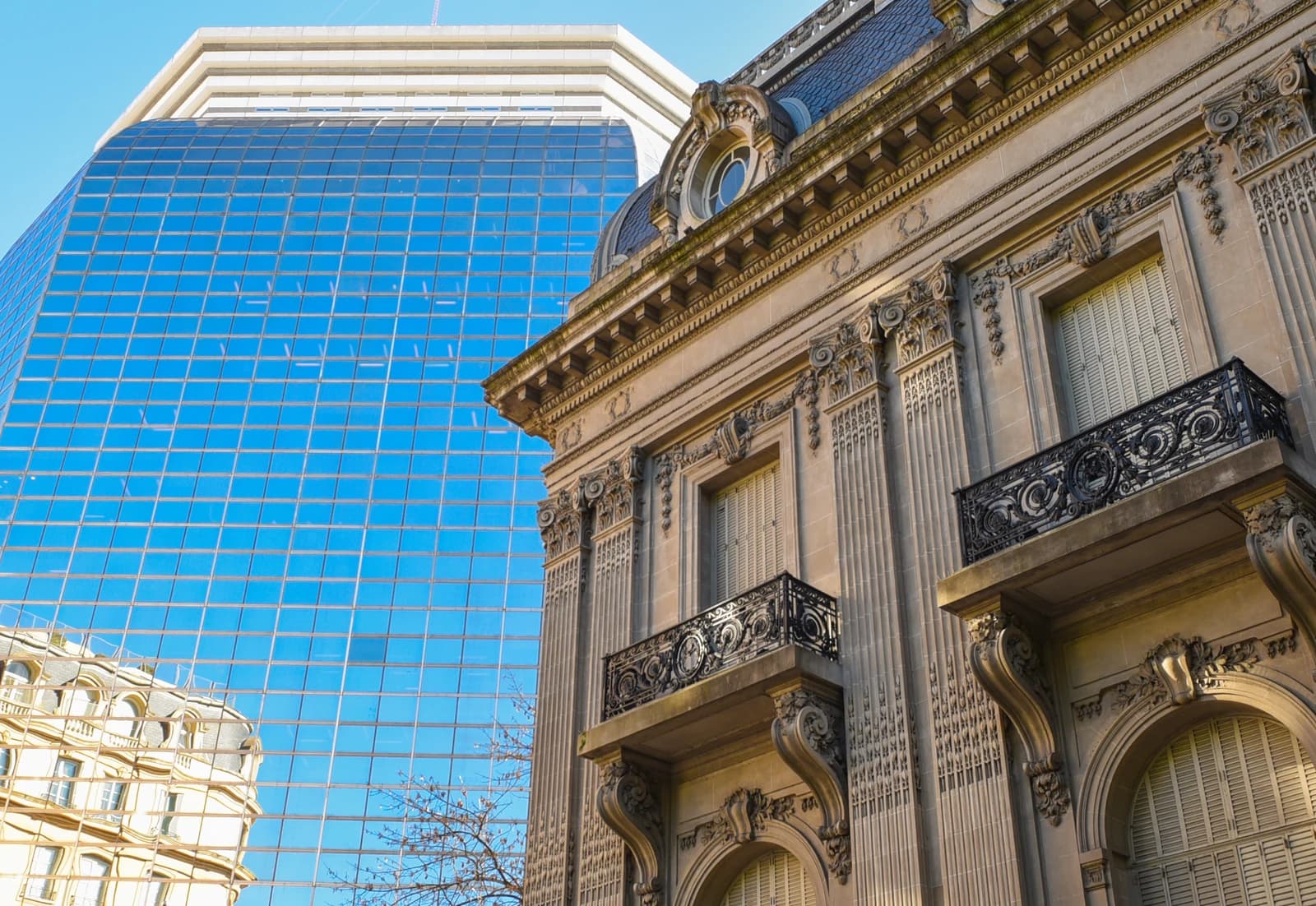 Close-up view of the historic Palacio San Martín and a modern glass building, Chancellery, in Buenos Aires.