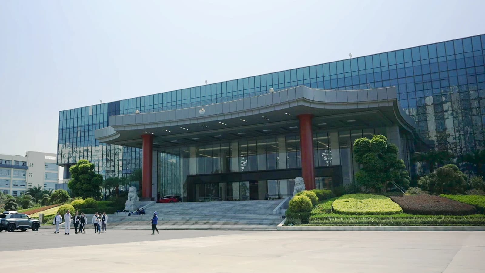 BYD Company Limited headquarters, a large modern glass building with a grand entrance.