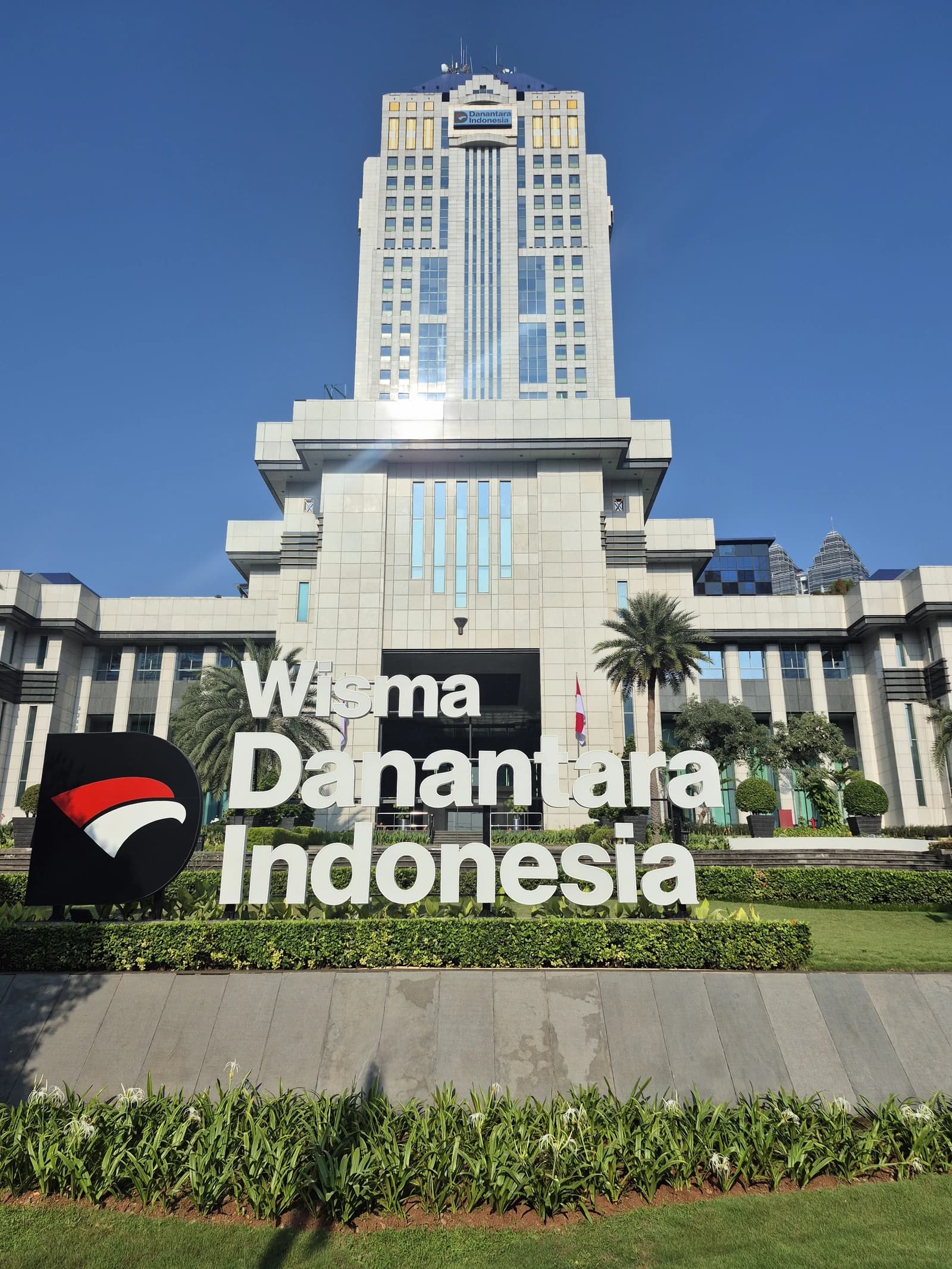 Exterior of Wisma Danantara Indonesia building with clear blue sky in Jakarta.