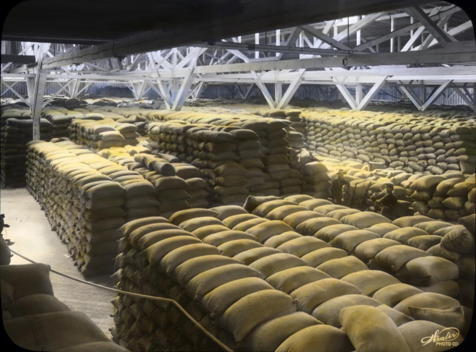 Stacks of wheat sacks fill a large warehouse in Portland, Oregon.