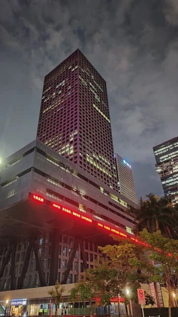 Shenzhen Stock Exchange Building in Futian, Shenzhen, China, illuminated at night.