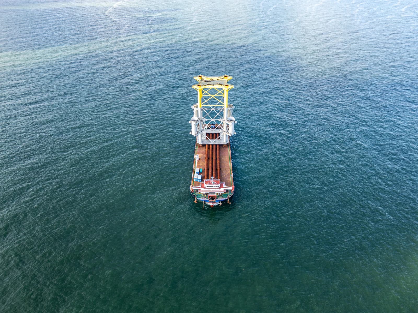 Aerial view of an offshore wind turbine installation vessel on the South China Sea.