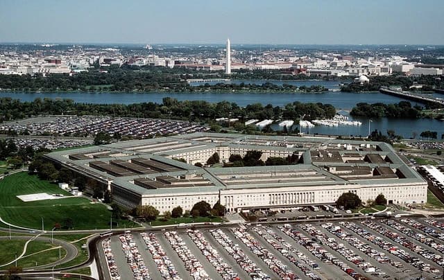 Aerial view of the Pentagon building, Arlington, Virginia, with the Washington Monument in the distance.