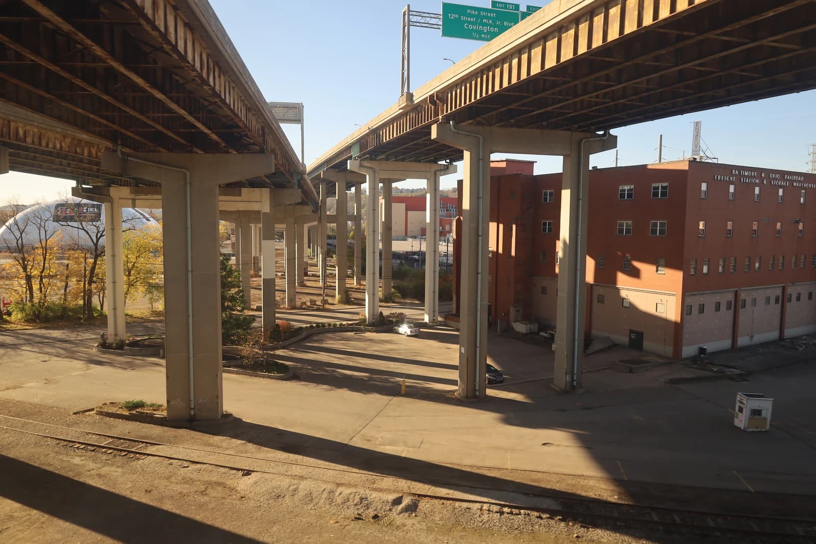 Brent Spence Bridge approach showing multiple highway overpasses and supporting pillars with a street below.