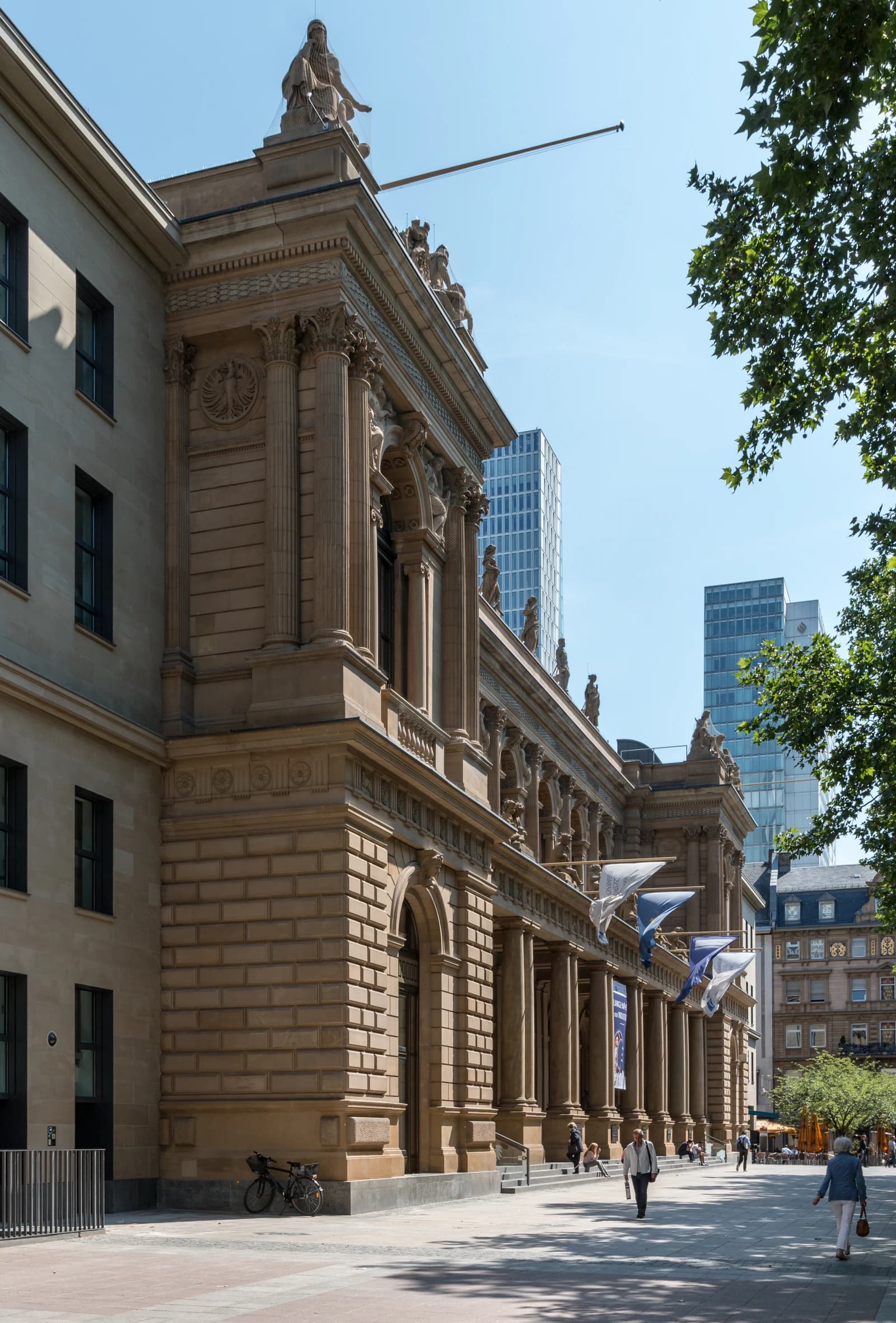 The historic Frankfurt Stock Exchange building stands under a clear blue sky in Frankfurt, Germany.