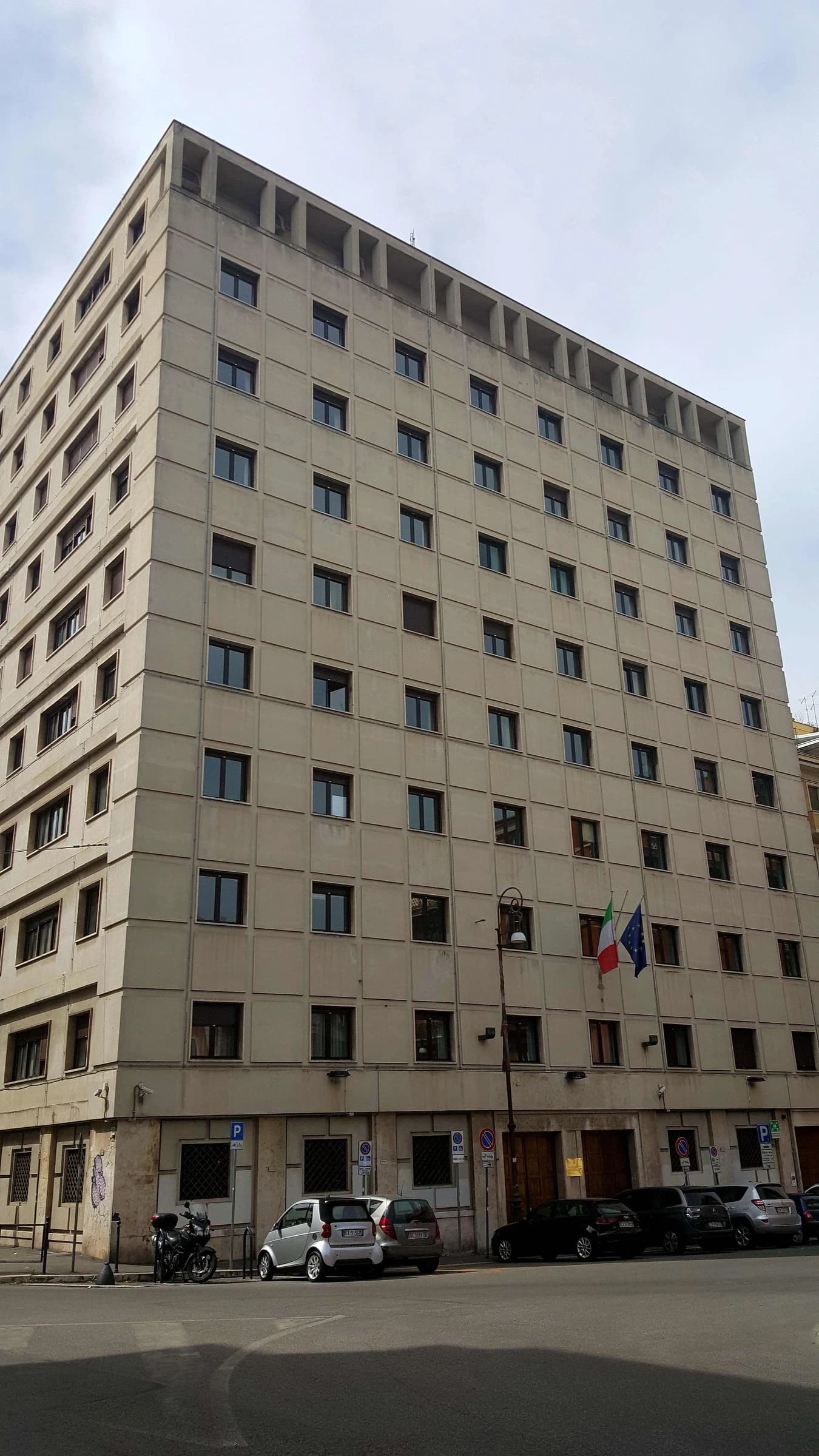 Building of the Ministry of Economy and Finance in Rome, Italy, with Italian and European flags.