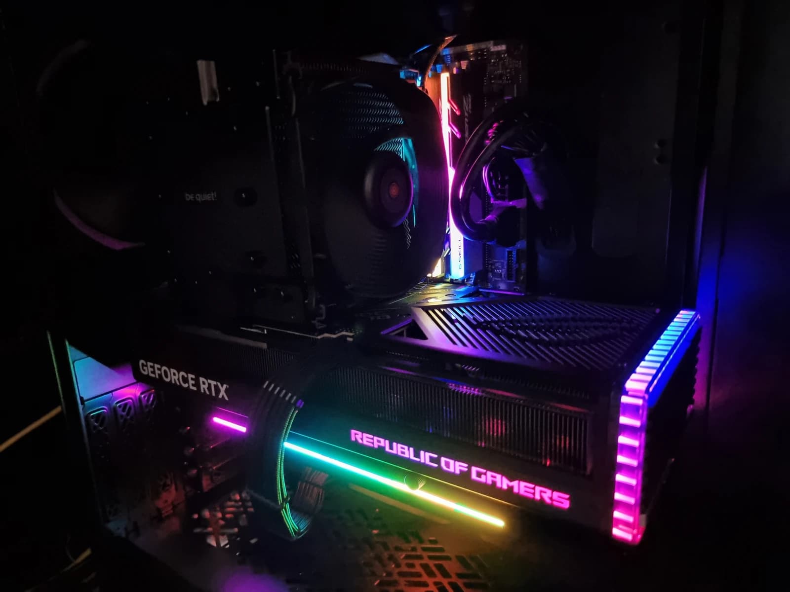 Close-up of an Asus Strix RTX 4090 graphics card inside a desktop computer case.