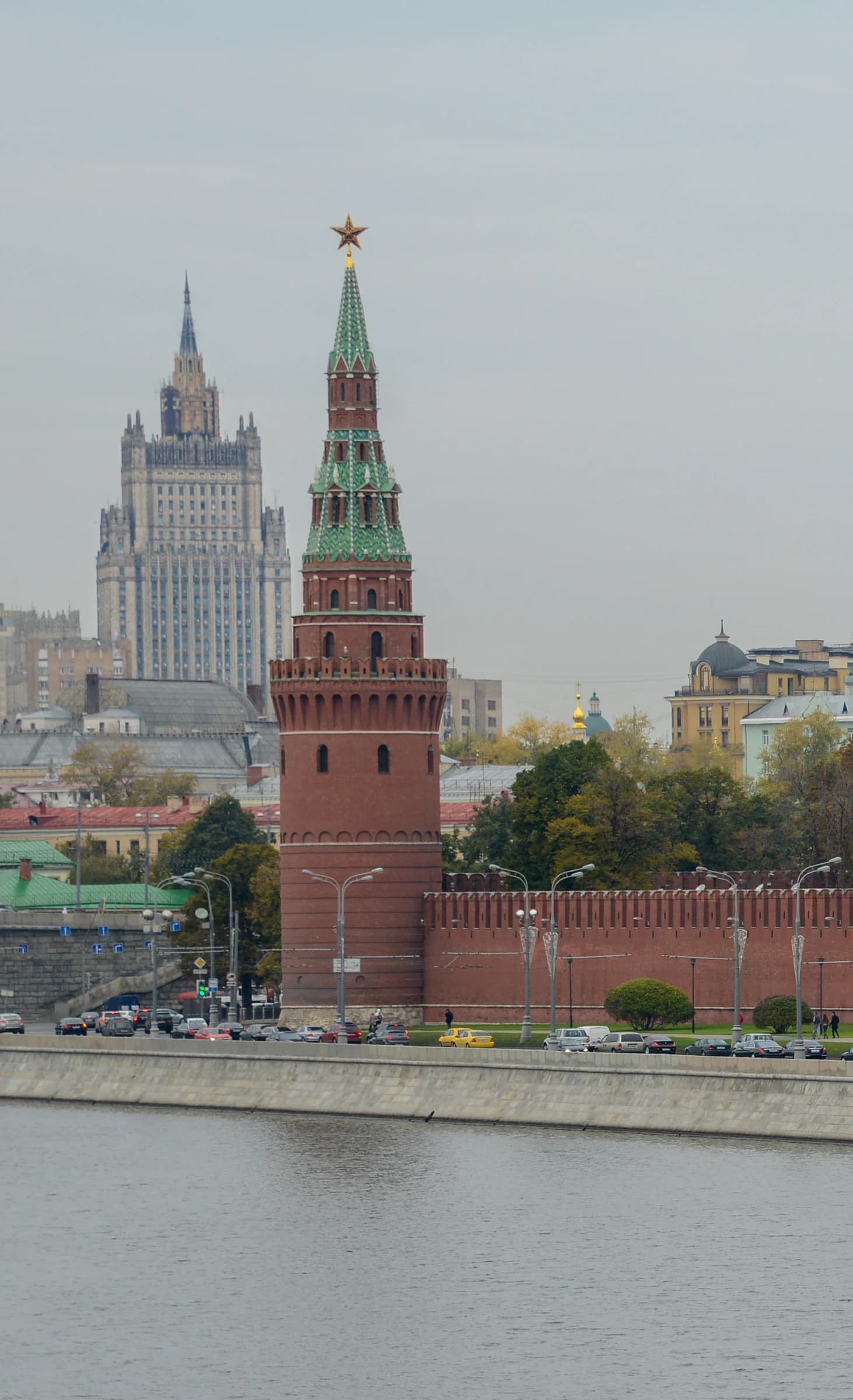 View of a Kremlin tower and the Ministry of Foreign Affairs building across a river.