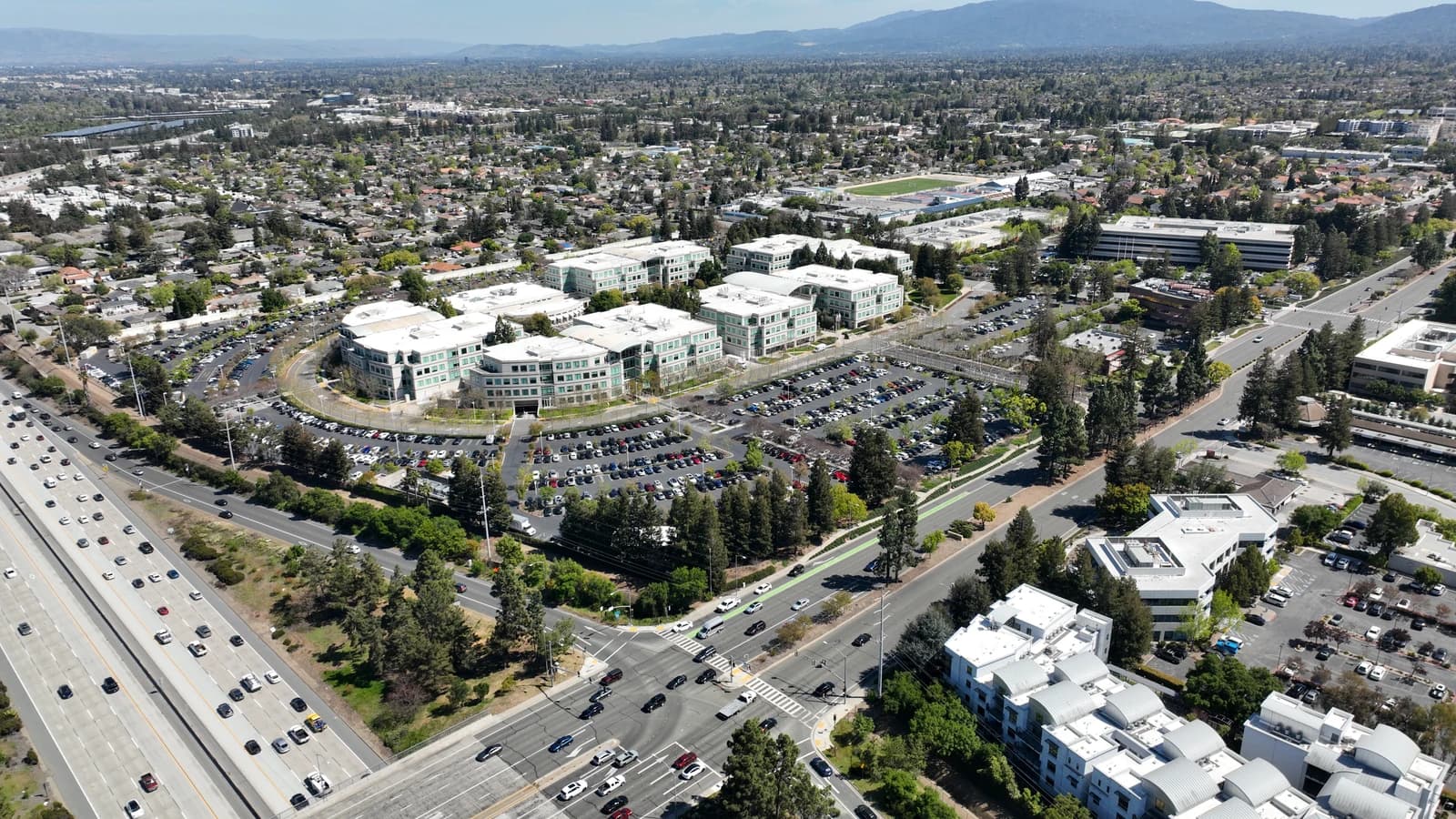 Aerial view of Apple's Infinite Loop campus buildings and surrounding area.