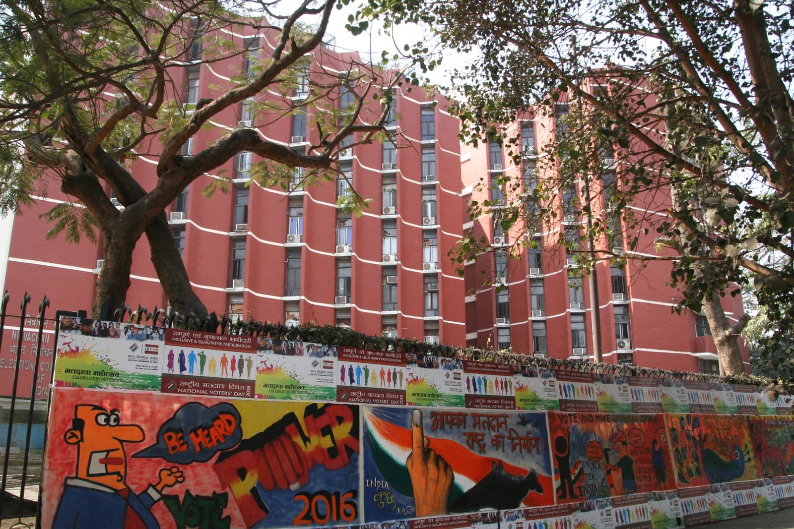 National Voter's Day posters on a wall outside the Election Commission of India building.