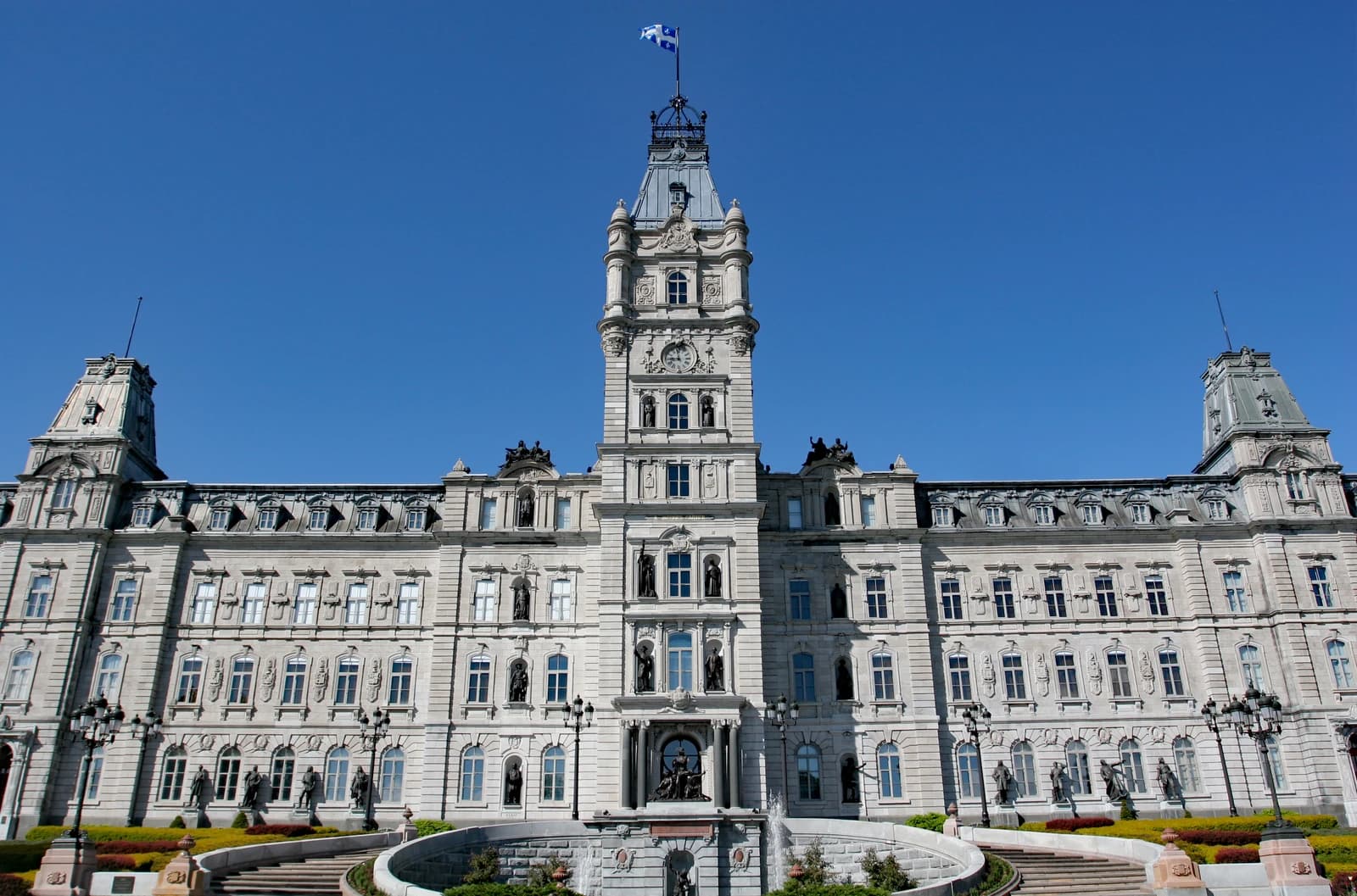 Parliament Building in Quebec City, Canada, with clear blue sky.