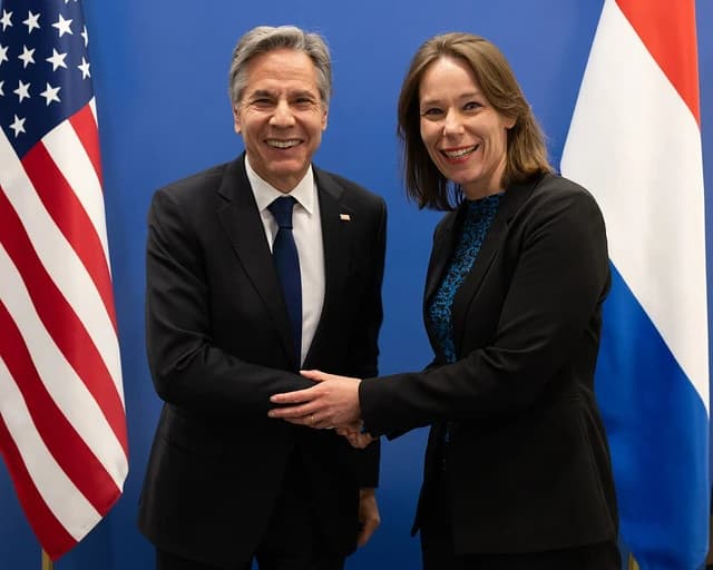 Antony Blinken, United States Secretary of State, shakes hands with Hanke Bruins Slot, Netherlands Foreign Minister, in Brussels.