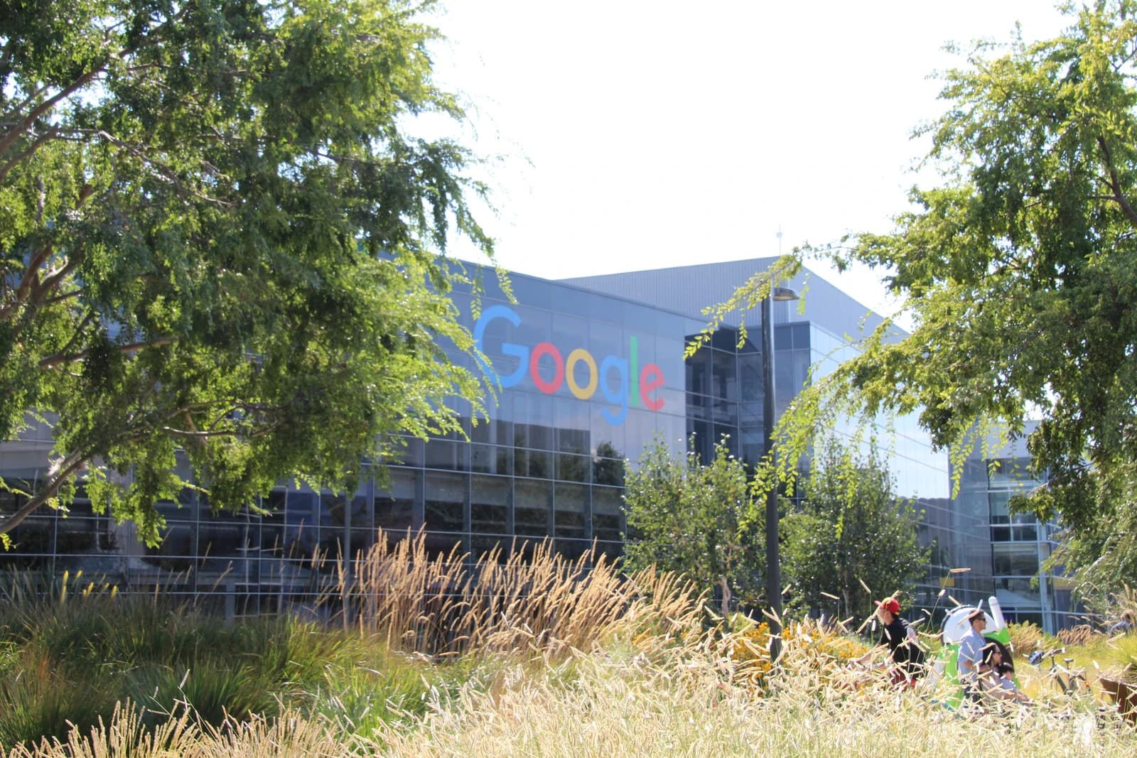The colorful Google logo displayed on the glass facade of a building at the Googleplex.