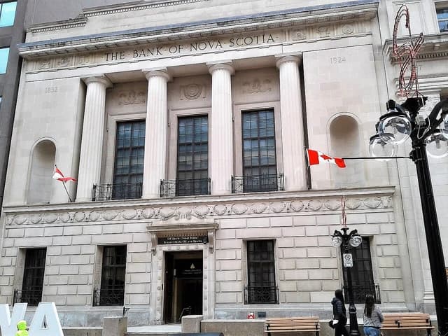 Bank of Nova Scotia building with "THE BANK OF NOVA SCOTIA" carved above columns.