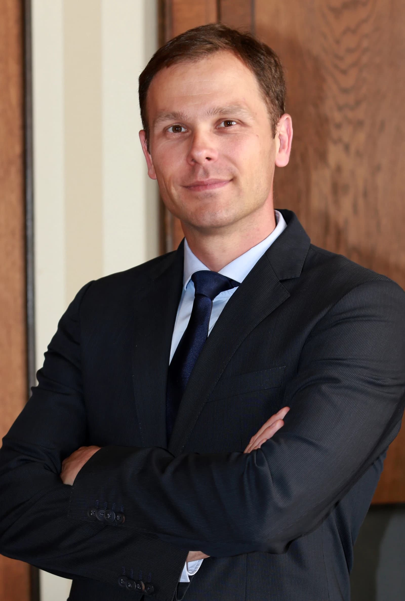 Siniša Mali, Minister of Finance of Serbia, posing for a portrait indoors.