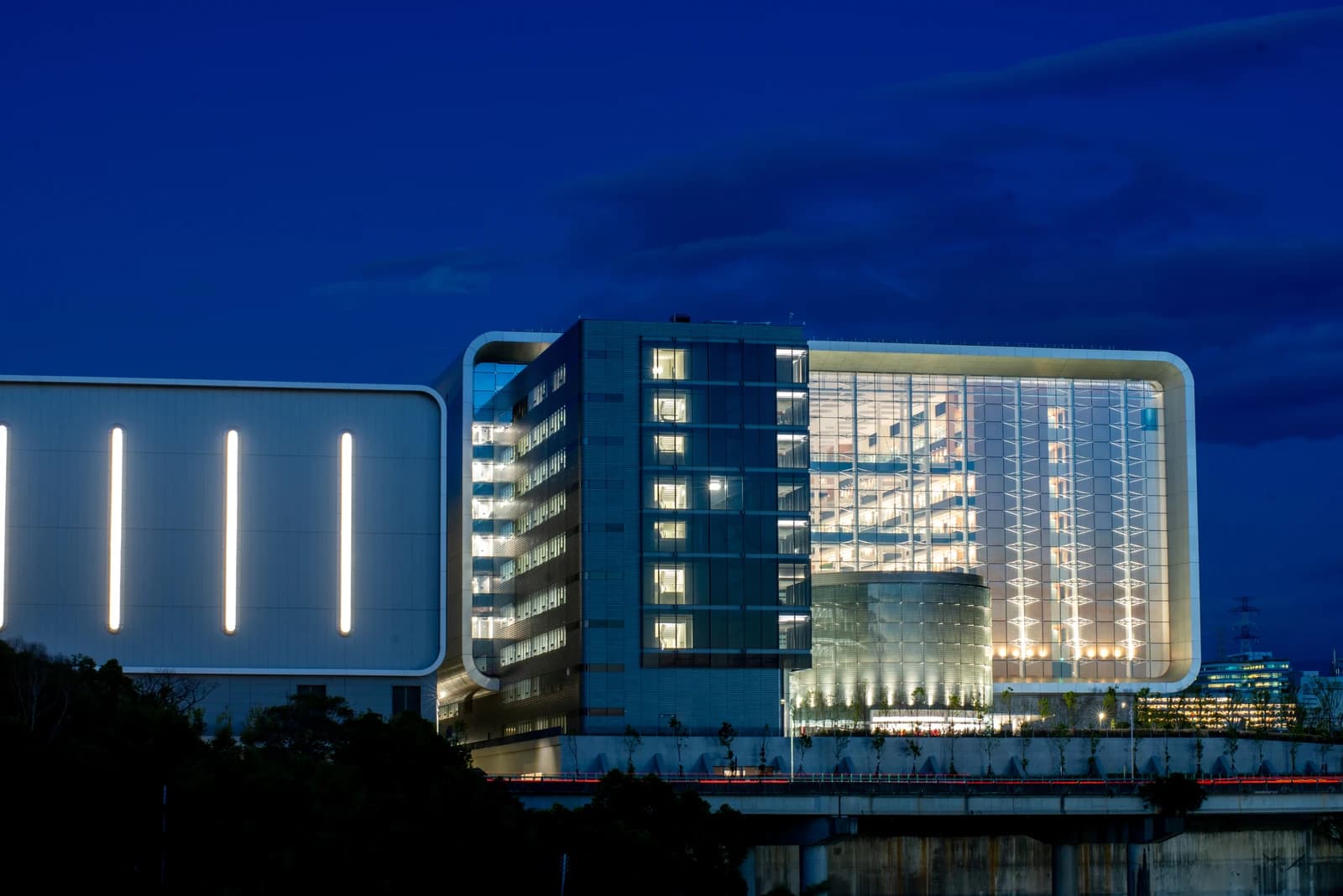 Exterior view of the TSMC Global R&D Center building illuminated at night.