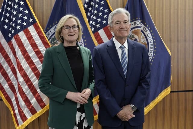 Mairead McGuinness, European Commissioner, stands with Jerome Powell, Federal Reserve Chair.