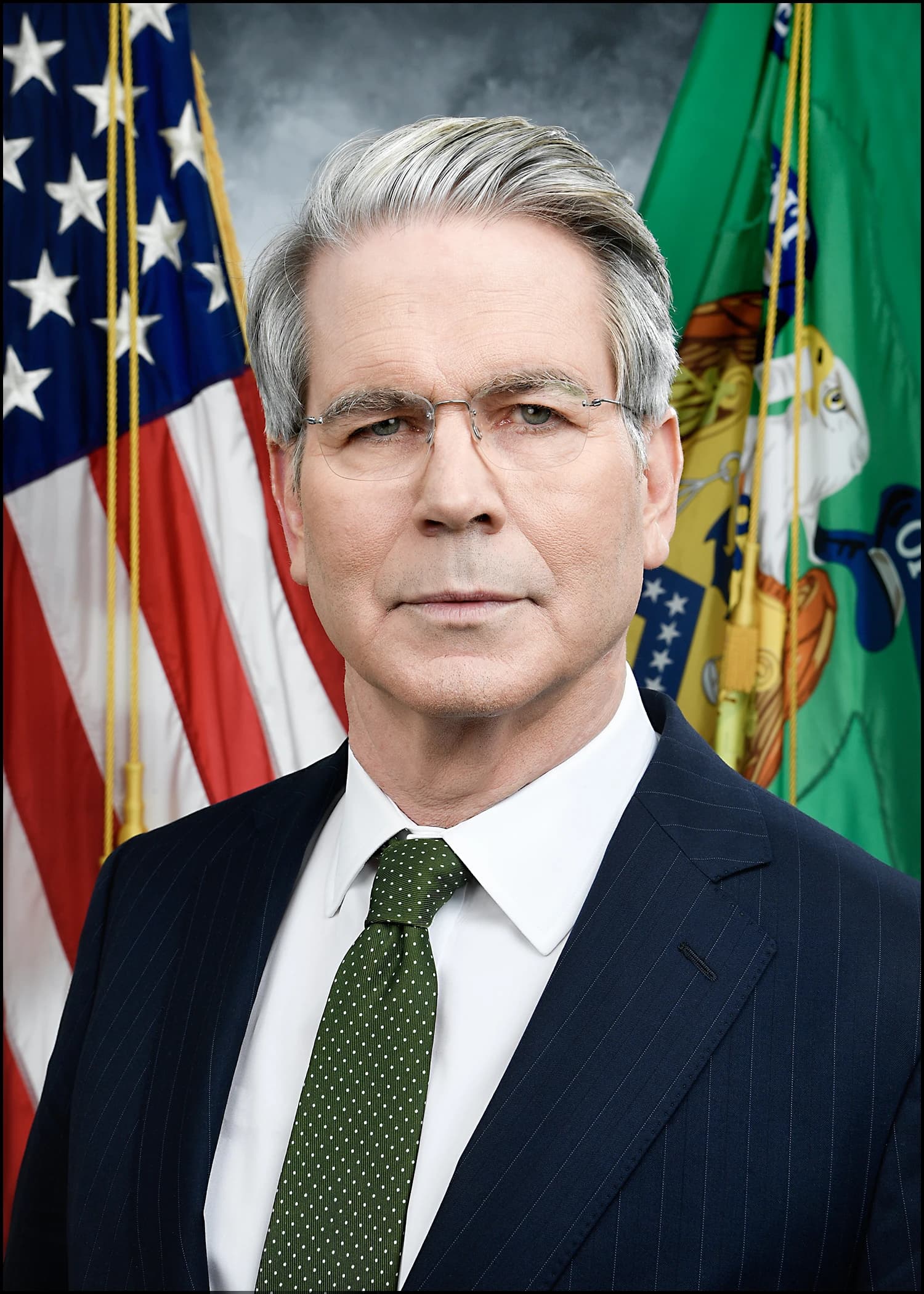 Treasury Secretary Scott Bessent poses for an official portrait with flags in the background.