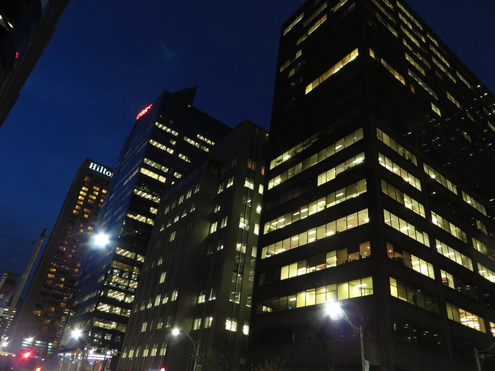 High-rise office buildings in Toronto's financial district at night.