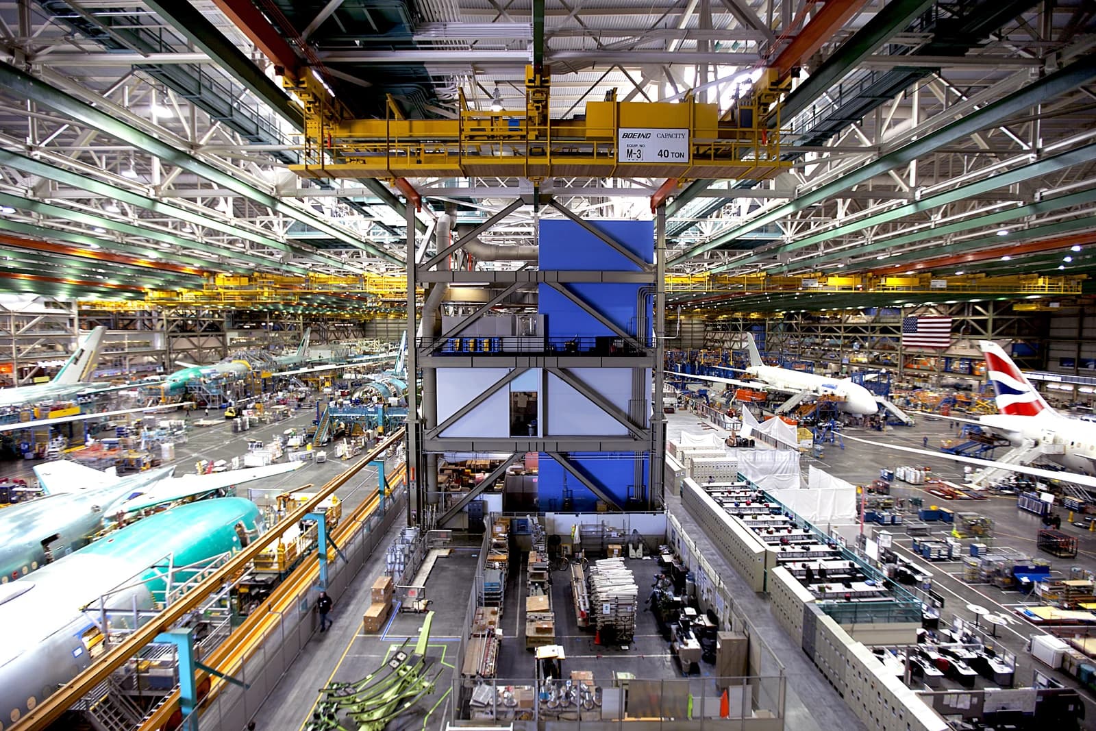 Interior of Boeing's Everett factory with multiple aircraft in various stages of assembly.